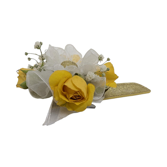 Yellow rose wrist corsage on a gold glitter slap bracelet with white ribbon